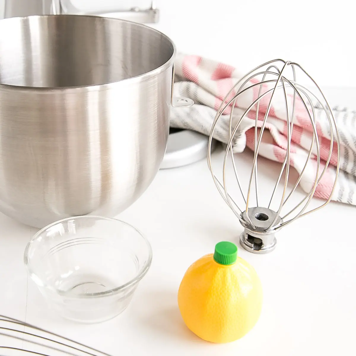 This old-fashioned 7 minute frosting recipe is light, delicious, and easy to make. A pure white frosting that's perfect for a variety of delicious desserts. | livforcake.com Tools to make the frosting -- mixer bowl, whisks, etc -- and lemon juice to wipe them down.