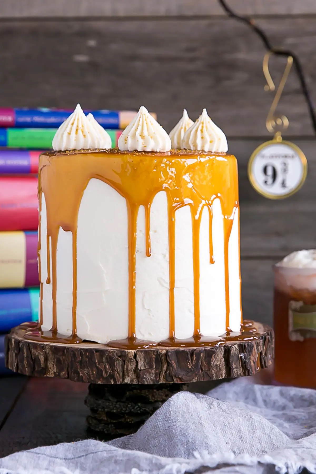Harry Potter Cake! This Butterbeer cake combines butterscotch, cream soda, and marshmallow all in one spellbinding dessert. | livforcake.com Close up of Butterbeer Cake.