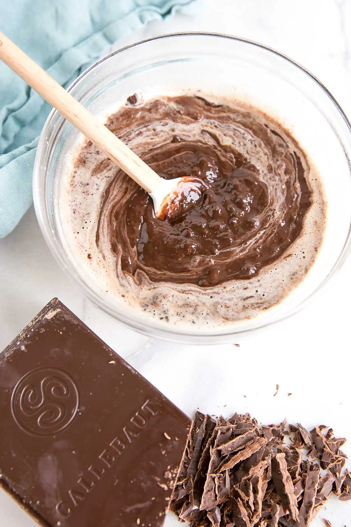 How to make Chocolate Ganache! A simple, two-ingredient recipe for a delicious frosting, filling, drip, or glaze. | livforcake.com The ganache starting to come together while stirring.