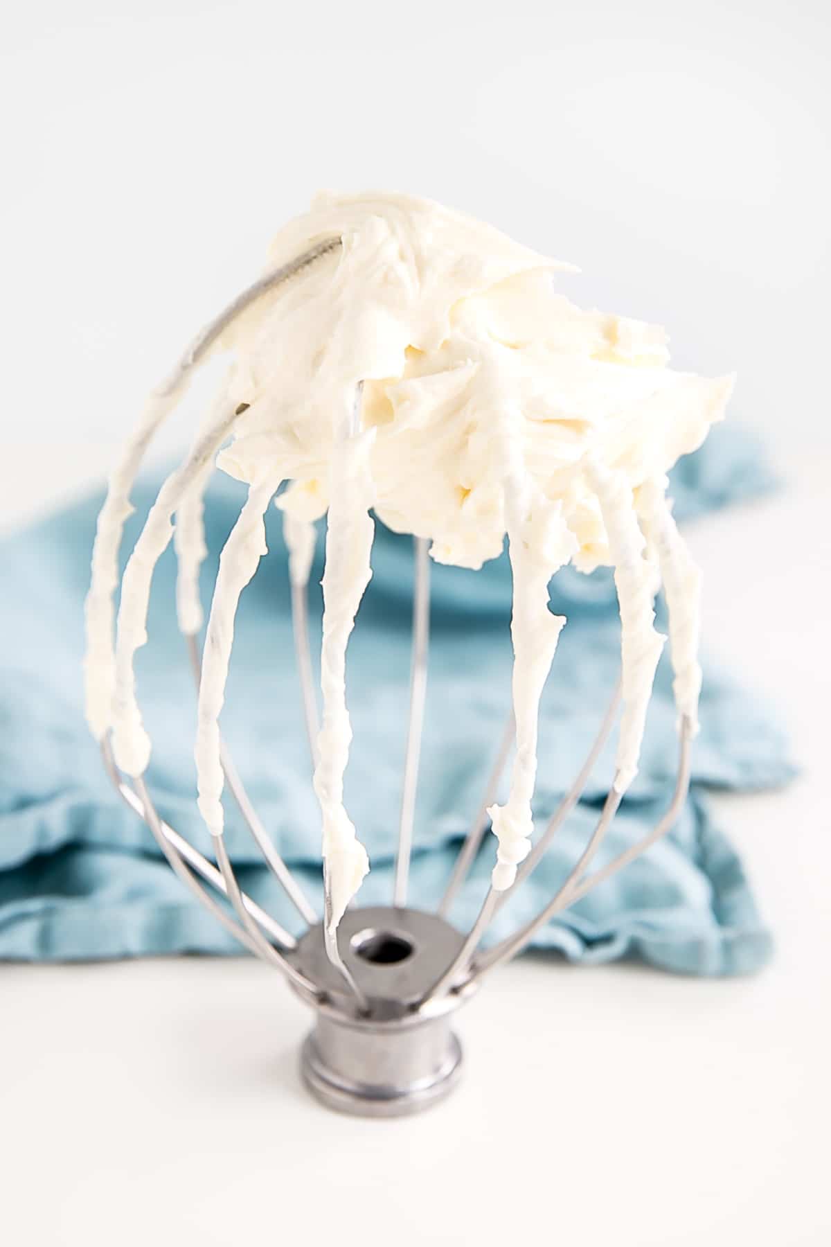 Ermine Frosting (also known as flour buttercream or heritage frosting) is an easy and delicious buttercream made with flour, sugar, milk, and butter. | livforcake.com Ermine Frosting on a whisk attachment.
