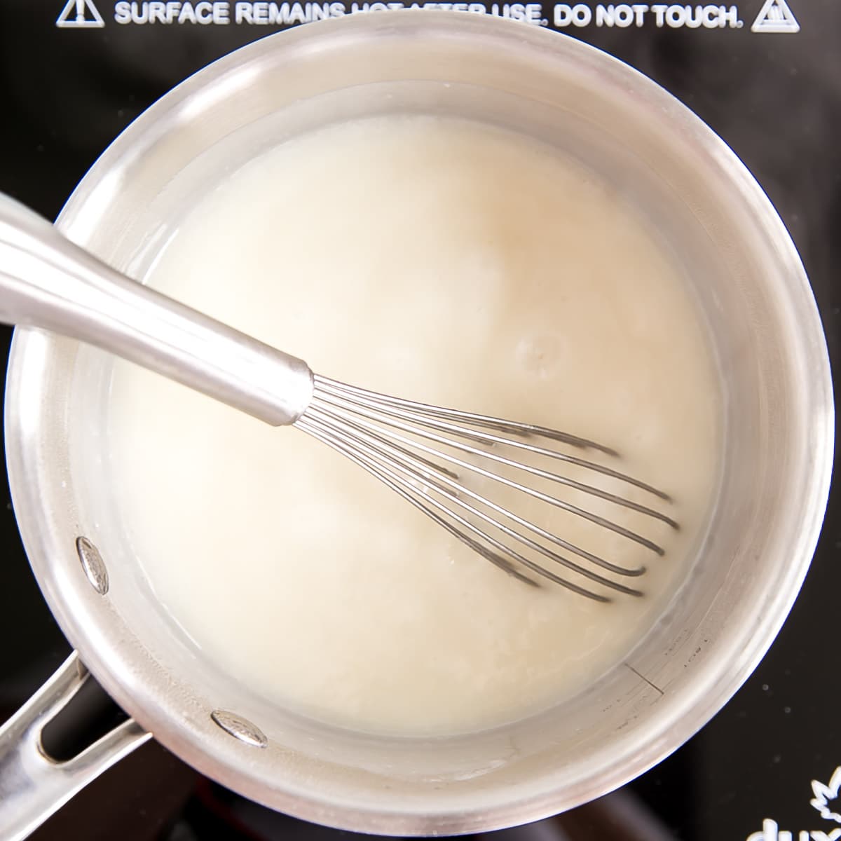 Ermine Frosting (also known as flour buttercream or heritage frosting) is an easy and delicious buttercream made with flour, sugar, milk, and butter. | livforcake.com The mixture thickened and boiling in a pot.