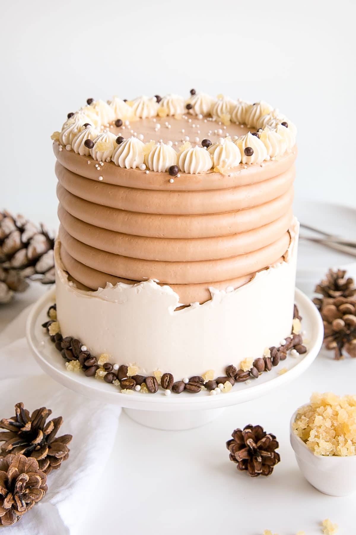 This Gingerbread Latte Cake is your favourite Holiday drink in cake form! Gingerbread spice cake layers with an espresso buttercream. | livforcake.com Angled shot of the cake.