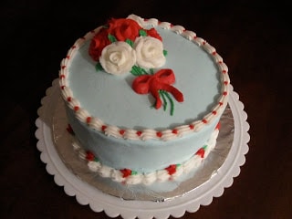 A birthday cake with piped roses