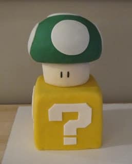 Fondant covered question block and mushroom.