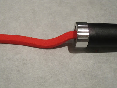 Red fondant coming out of the extruder.