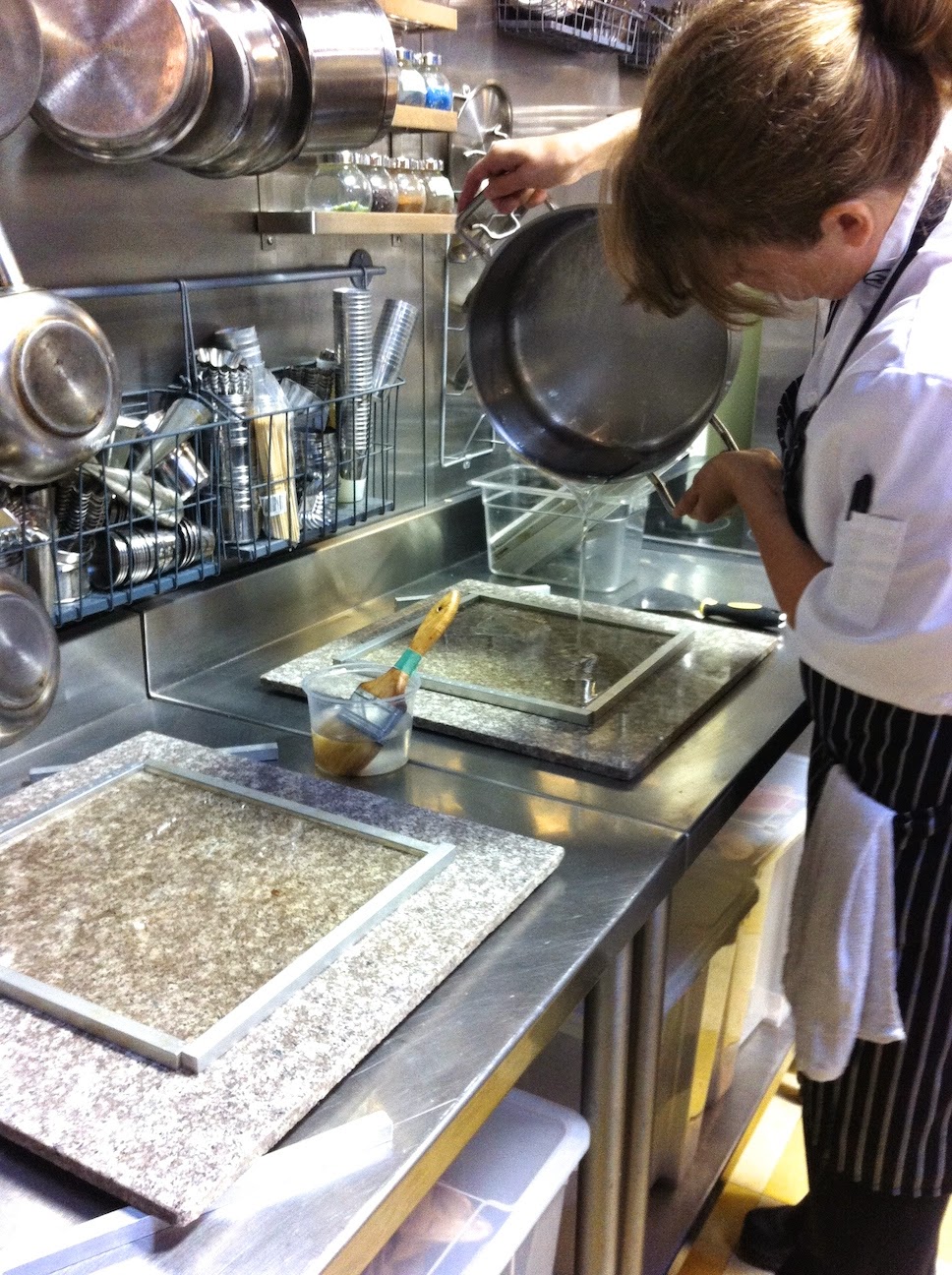 A man cooking in a kitchen preparing food