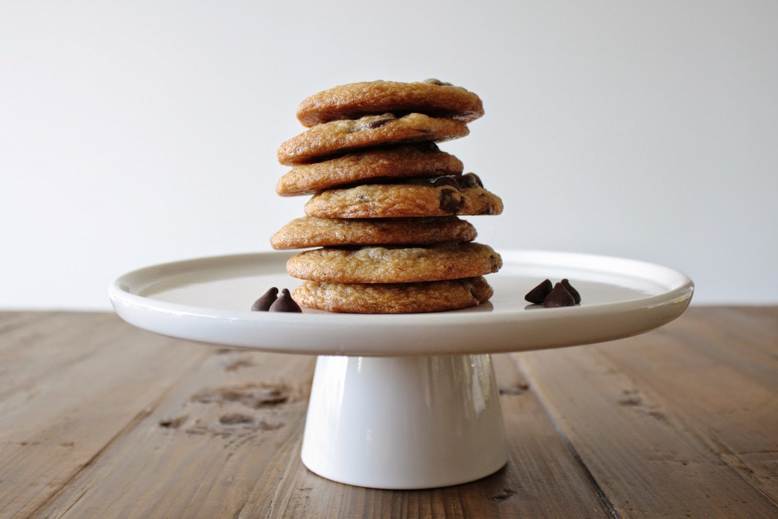 Cookies stacked on a cake stand.