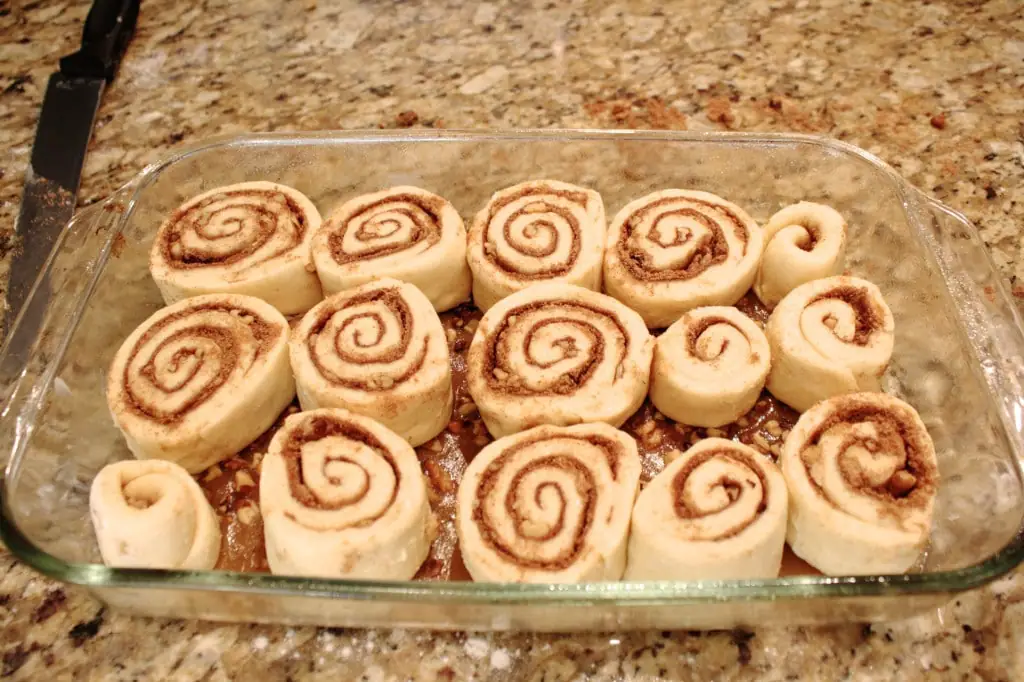These easy overnight cinnamon rolls are a huge time saver! Make them in advance and pop them in the oven on Christmas morning. | livforcake.com Rearrange rolls as needed so they are evenly distributed