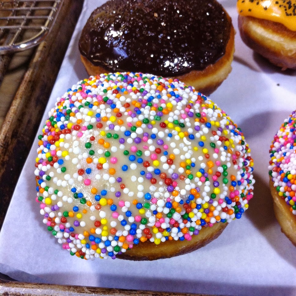 A close up of a doughnut sitting on top of a table
