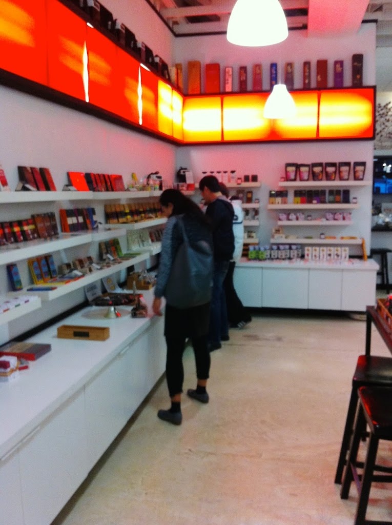 A person standing in front of a store