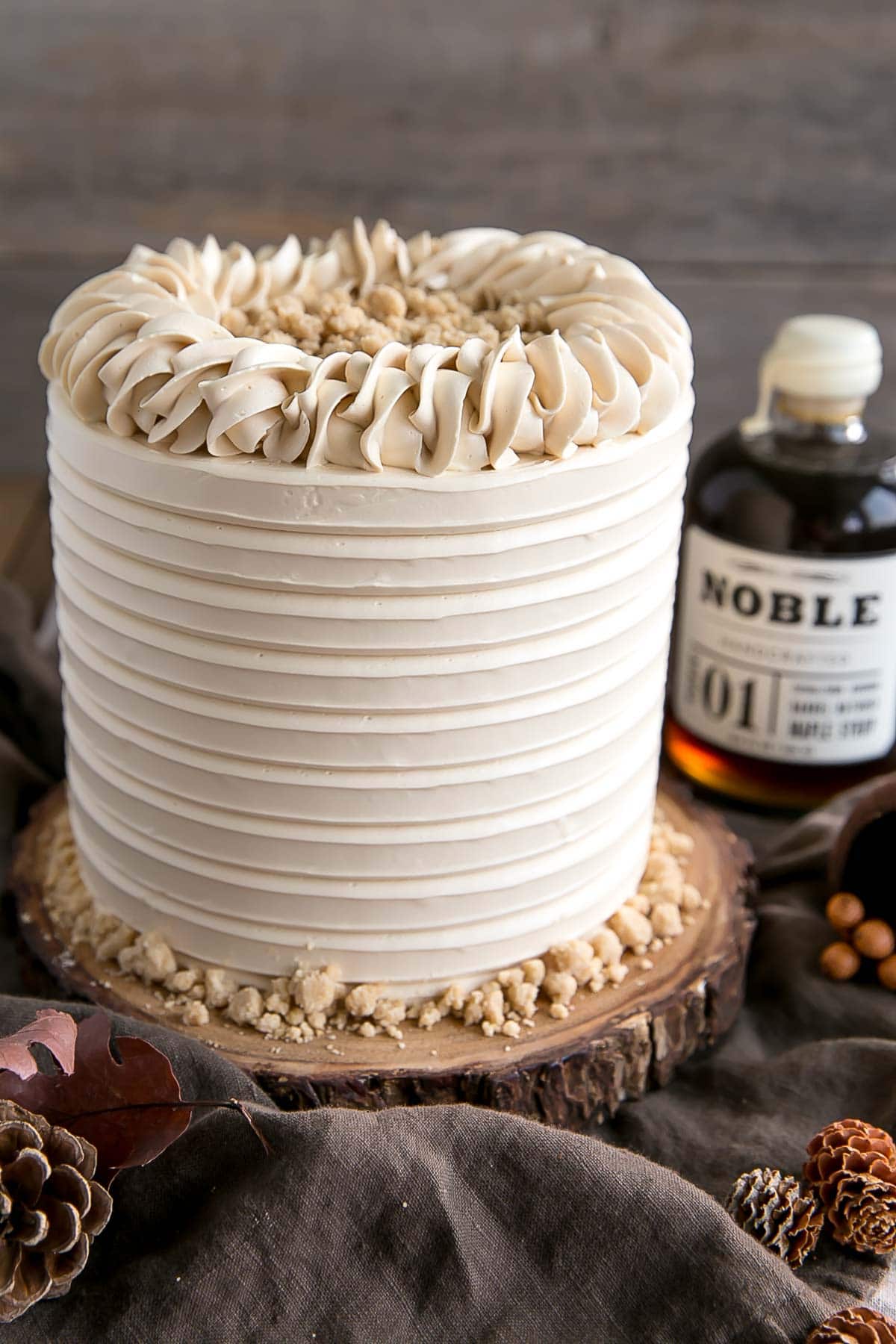 This Maple Cake is packed with pure, natural maple flavour throughout. Maple cake layers with a maple buttercream and maple streusel. | livforcake.com Maple layer cake made with pure maple syrup.