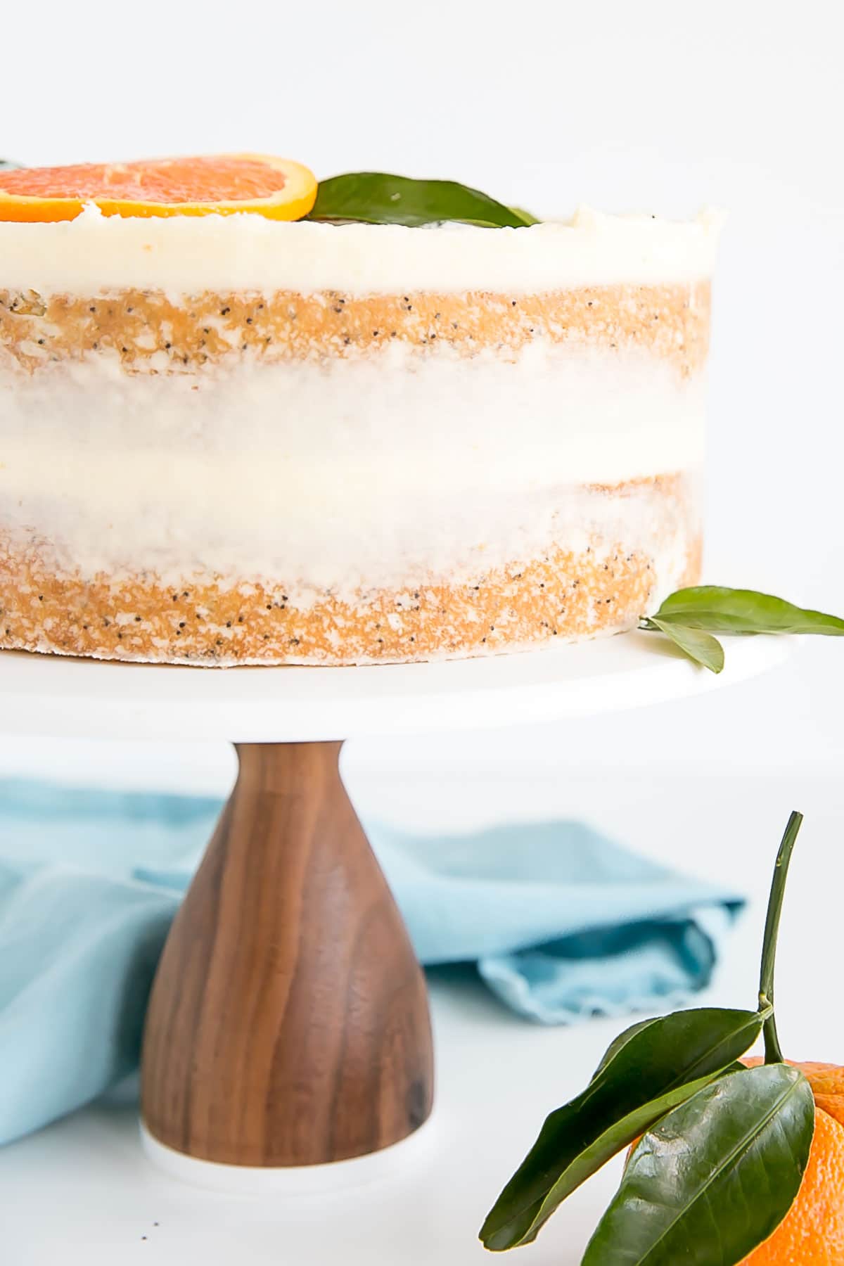 Close up of side of orange poppy seed cake layers