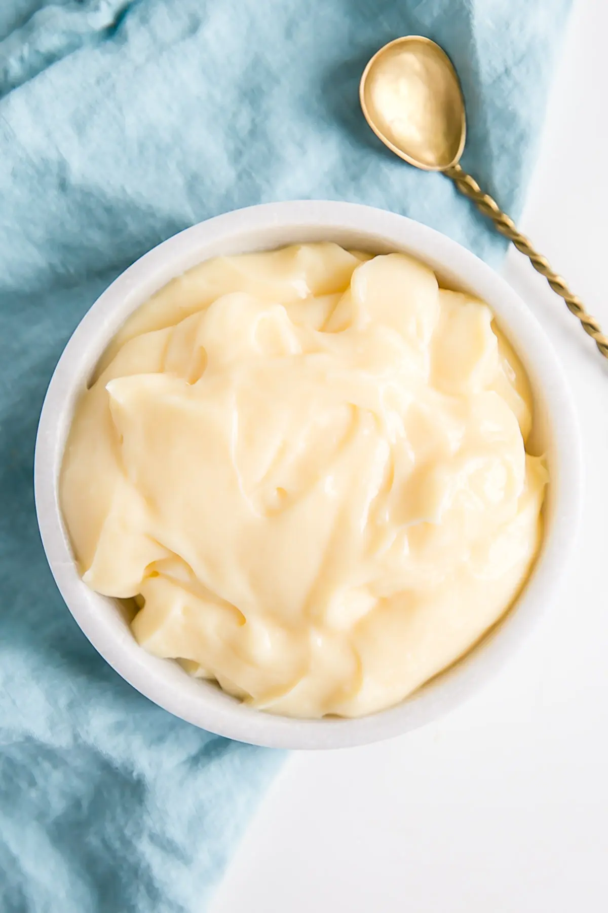 This custard-based German buttercream is made with just a few simple ingredients. Perfect for those who like a rich and silky frosting that isn't too sweet! | livforcake.com Pastry Cream (Creme Patissiere) in a bowl.