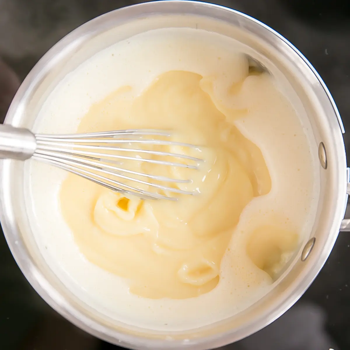 This easy Pastry Cream (Creme Patissiere) recipe is simple and delicious. A rich and creamy vanilla custard you can use in a variety of decadent desserts. | livforcake.com Pastry cream brought to a boil.