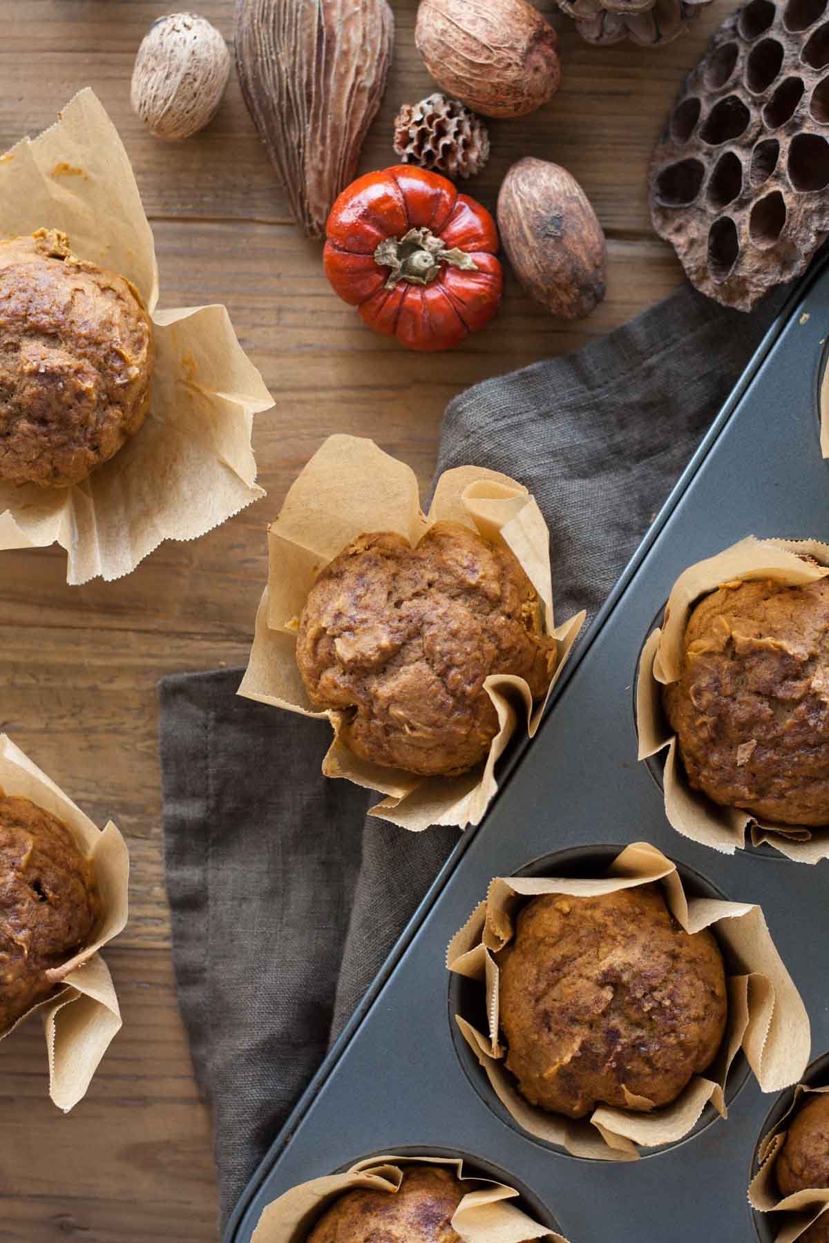 Overhead shot of pumpkin muffins. Some in the cupcake pan.