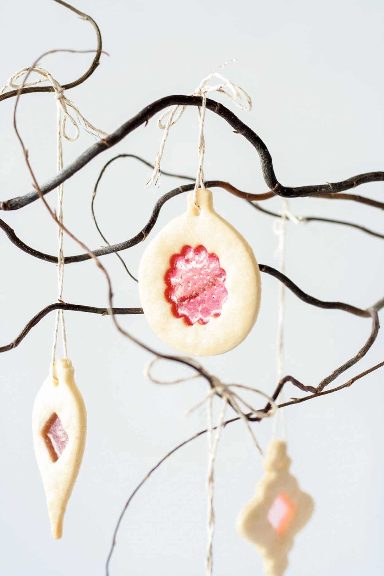 Learn how to make stunning stained glass cookies with this detailed tutorial! Perfect for holiday cookie exchanges or hanging on your tree. | livforcake.com Close up of a stained glass cookie