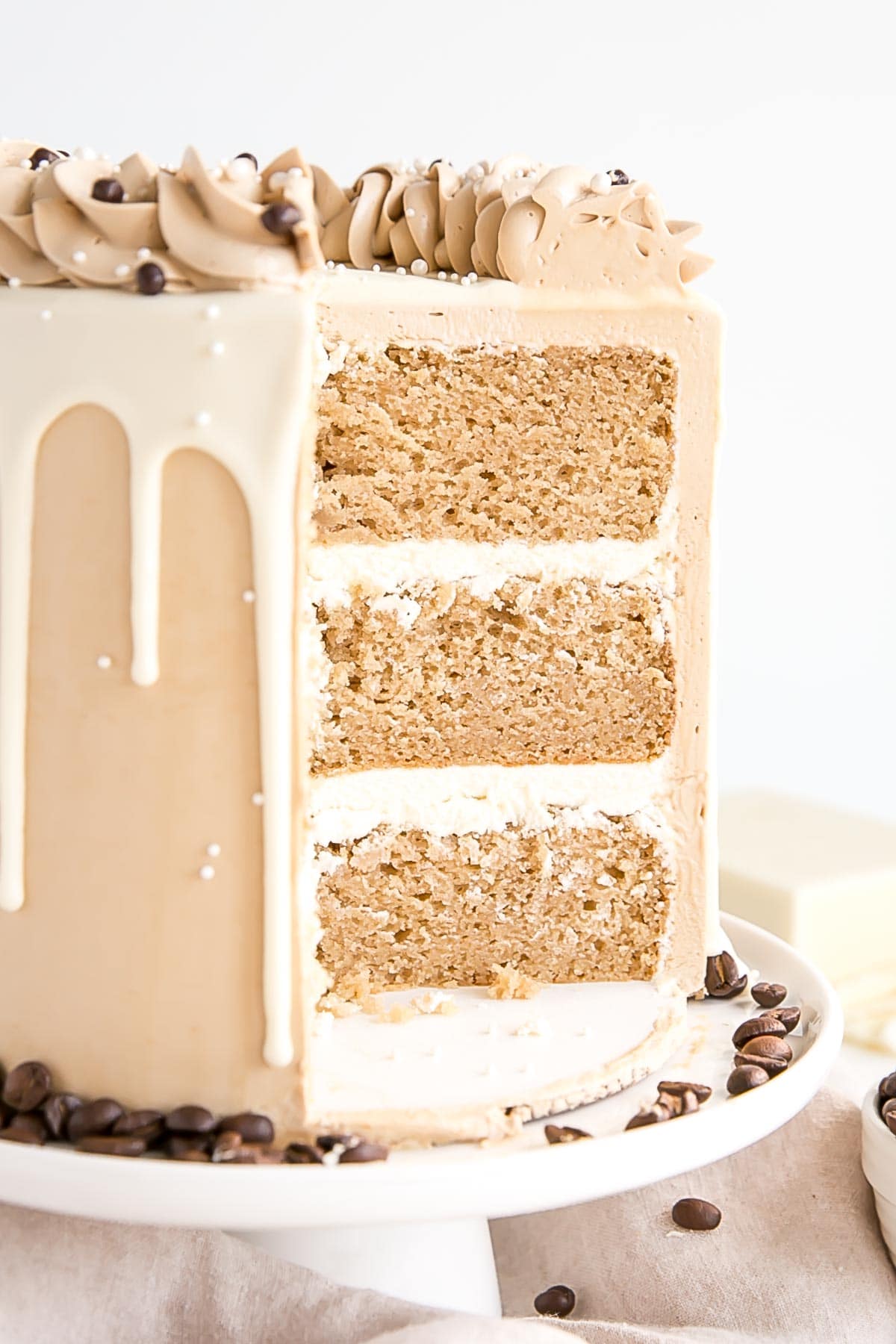 Cross section of the cake showing layers and white chocolate ganache filling.
